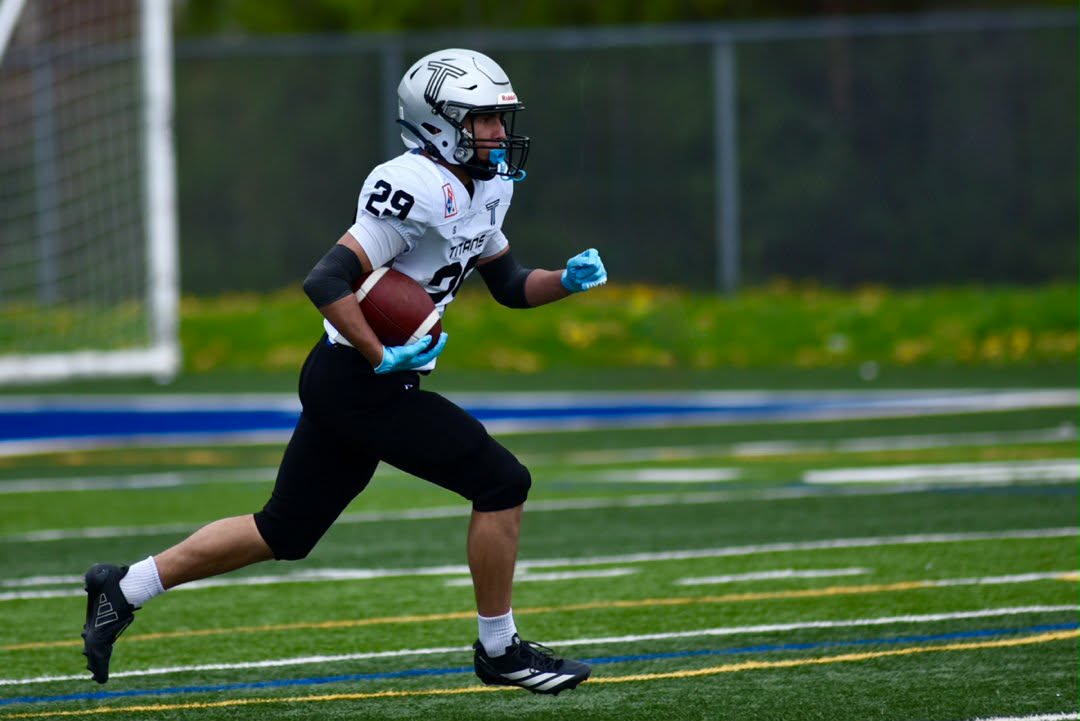 Jack Katsilieris carrying the football during the 2026 OSFL season