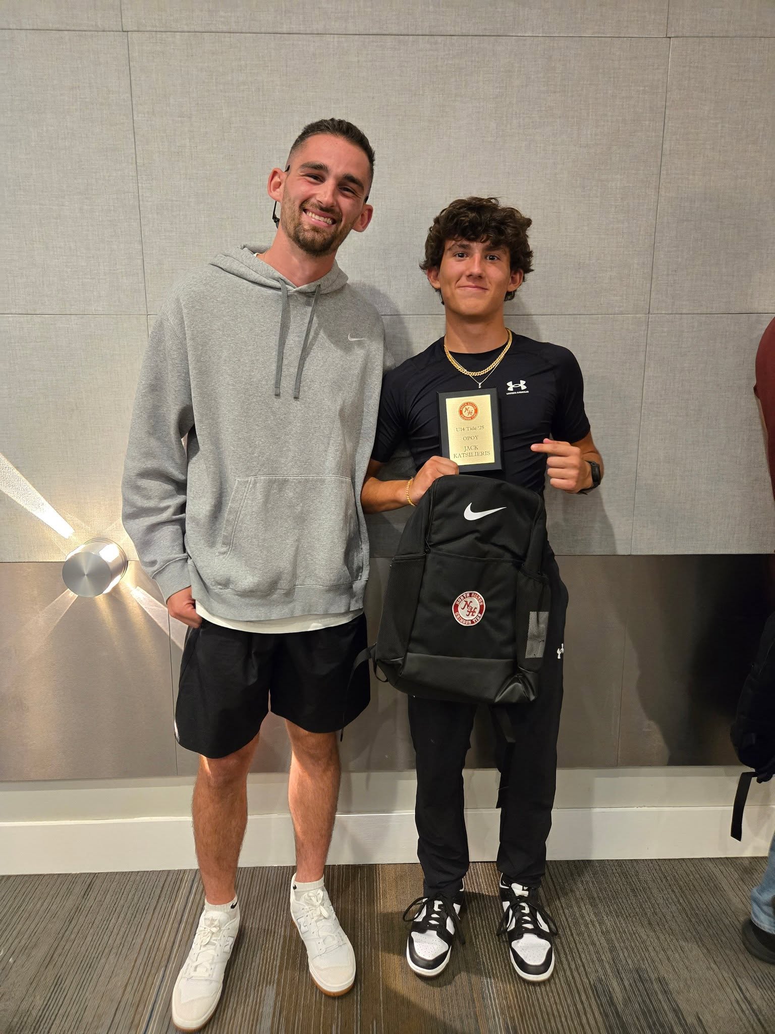 Jack Katsilieris with his North Halton Crimson Tide coach after receiving the 2025 U14 Offensive Player of the Year award