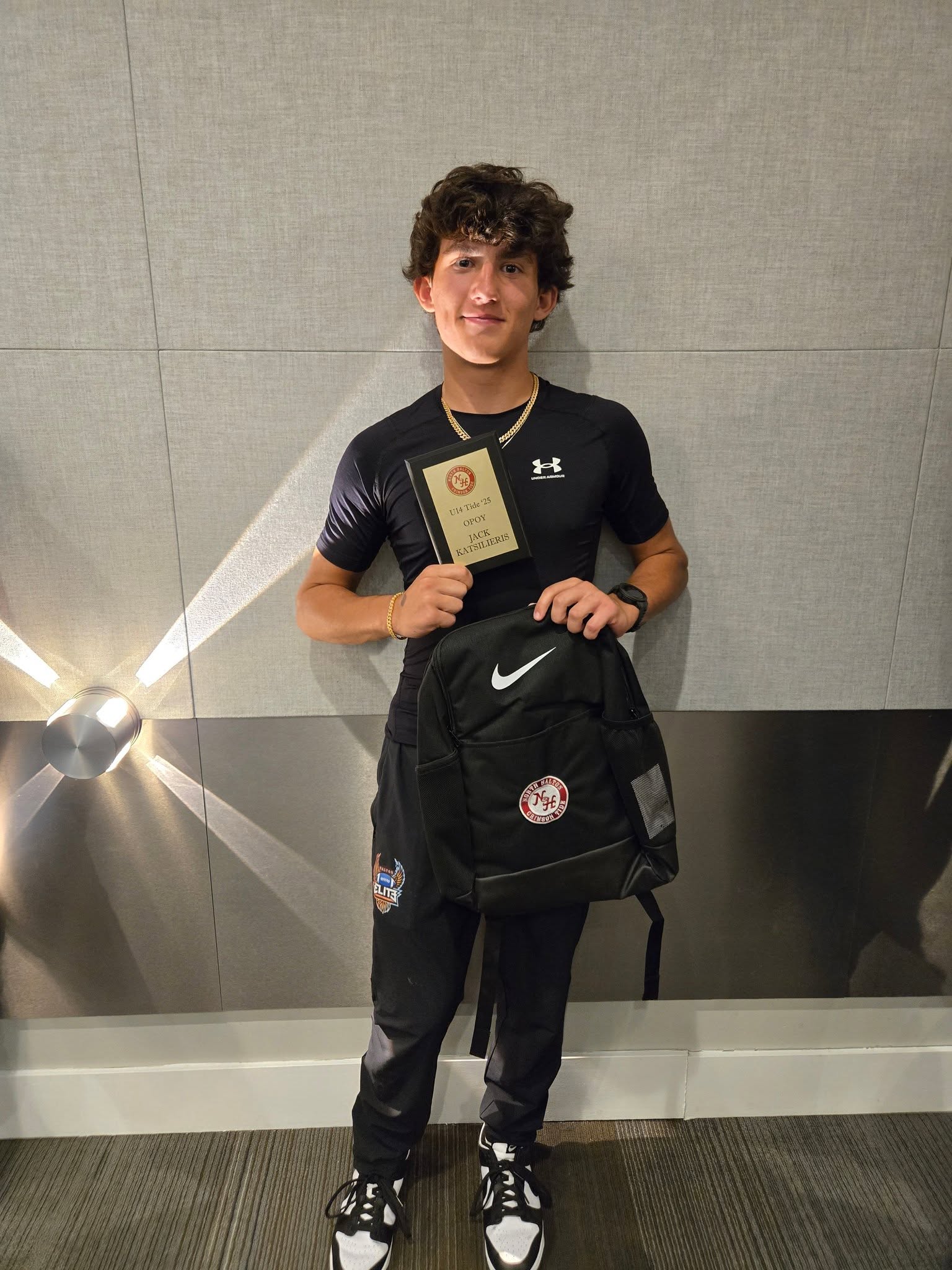 Jack Katsilieris holding his 2025 North Halton Crimson Tide U14 Offensive Player of the Year award